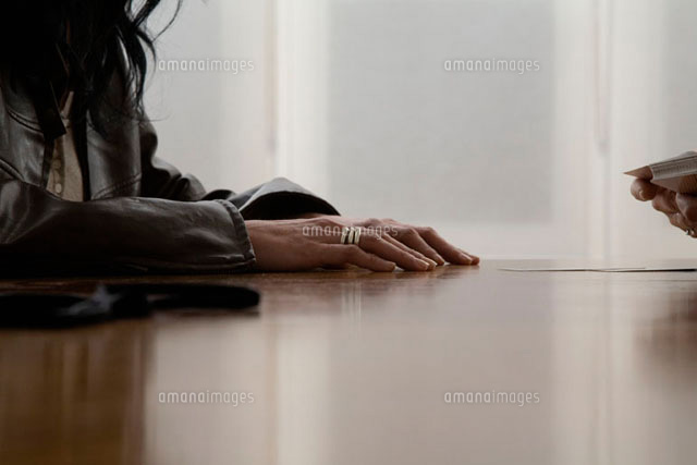 A woman waiting to have a tarot reading
(c)Ableimages/fStop