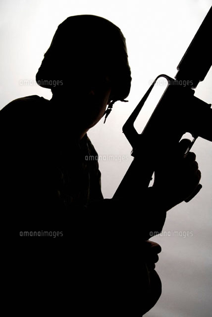 Silhouette of a soldier holding a gun
(c)Stella/fStop