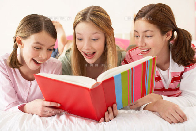 Girls Looking at Book Together
(c)Radius Images