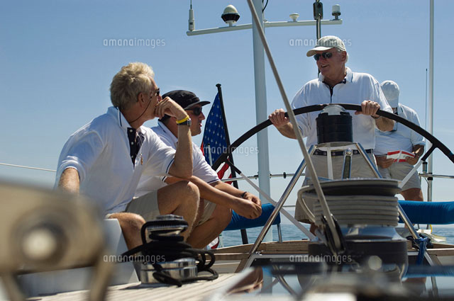 Sailors talking at Helm on Yacht
(c)moodboard