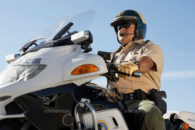 Police officer riding on motorcycle
(c)moodboard