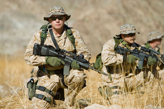 Soldiers with rifles in field
(c)moodboard