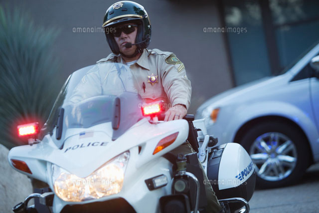 Patrol officer sits on motorcycle with hazrd lights lit
(c)moodboard