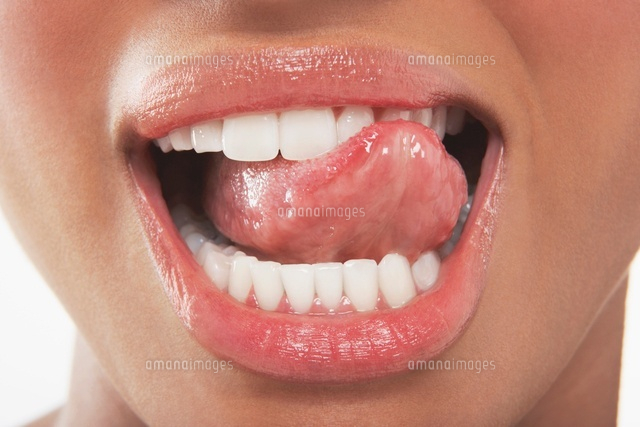 Woman Licking Her Teeth
(c)moodboard