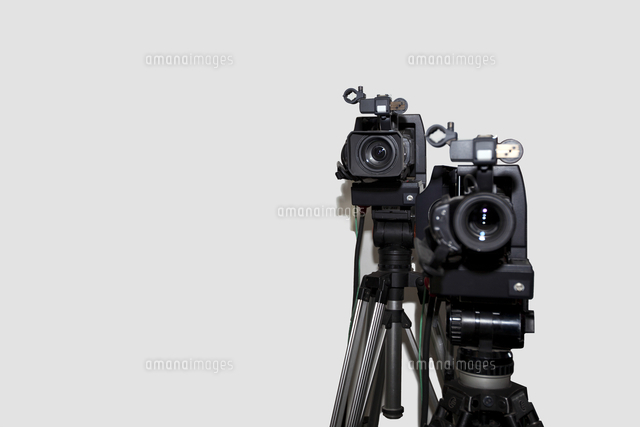 Camera and tripod against white background
(c)moodboard