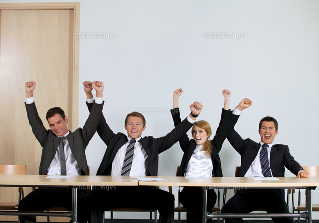 Business people punching air in office, cheering
(c)moodboard