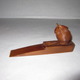 11． 玄関扉ストッパー（チーク材）（幅18×奥行4×高さ8.5cm）
