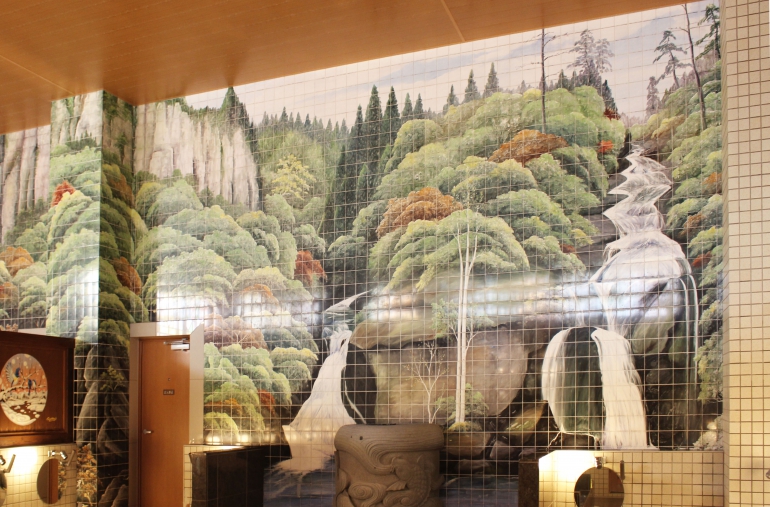 Waterfall tile mural in the women’s bath